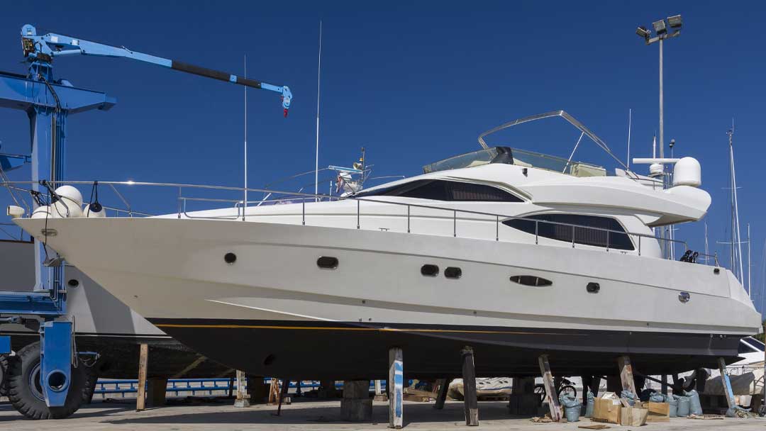 A yacht hauled in land for antifouling