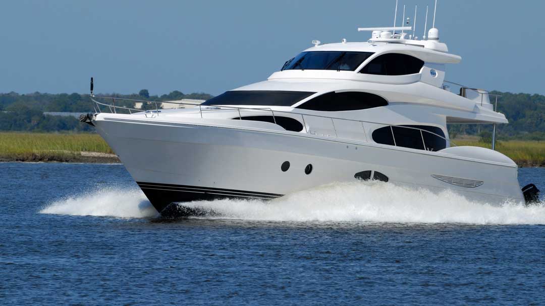 A beautiful white Yacht speeding across the water