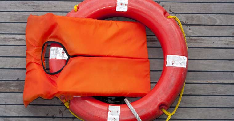 Orange life jacket and lifebuoy