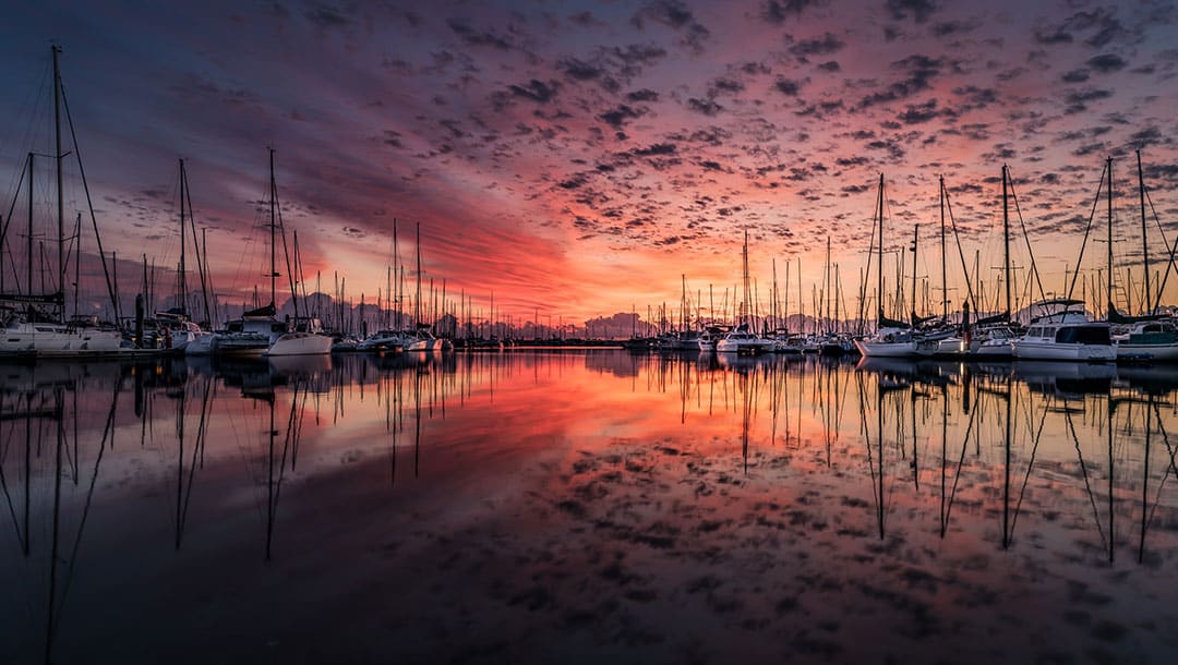 Yachts moored up at sunset